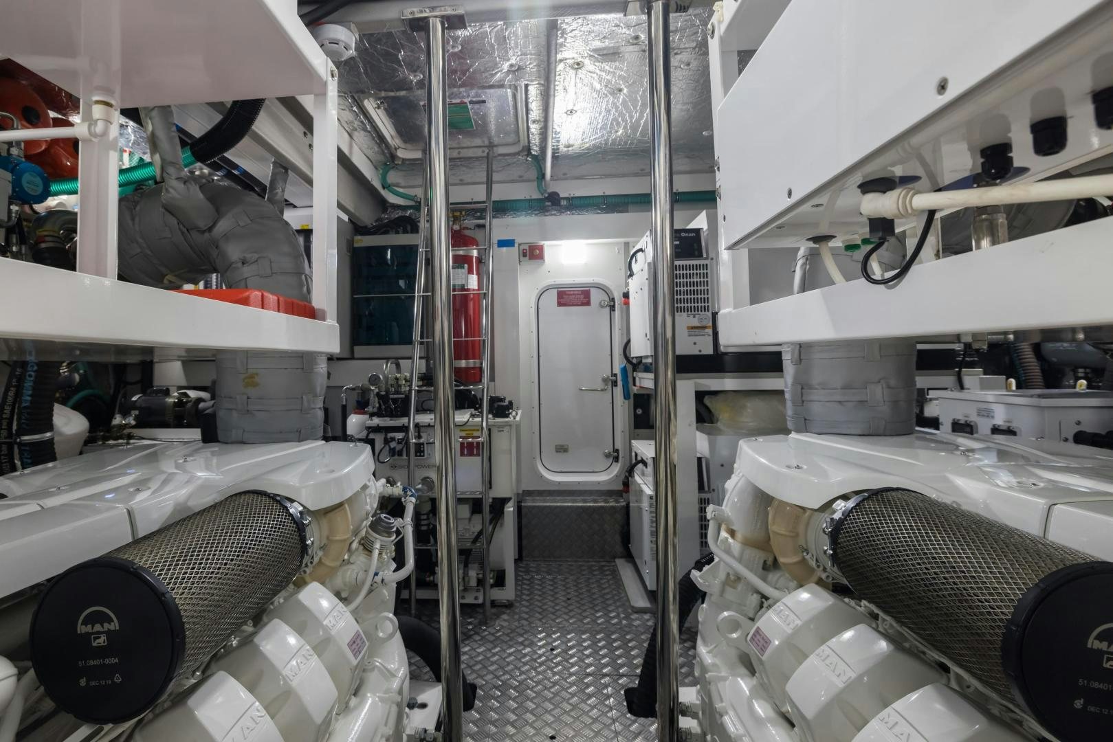 a room with several white pipes aboard MR. G Yacht for Sale