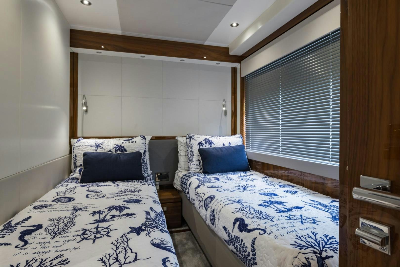 a couple of beds in a room aboard MR. G Yacht for Sale