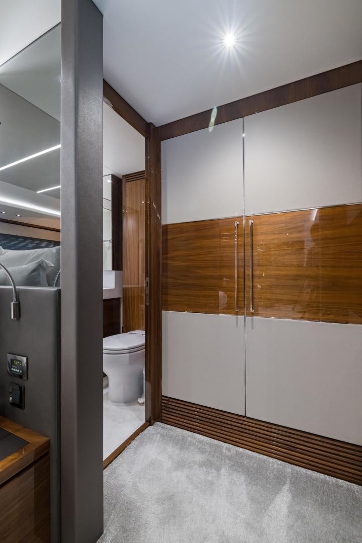 a bathroom with a toilet and a shower aboard MR. G Yacht for Sale