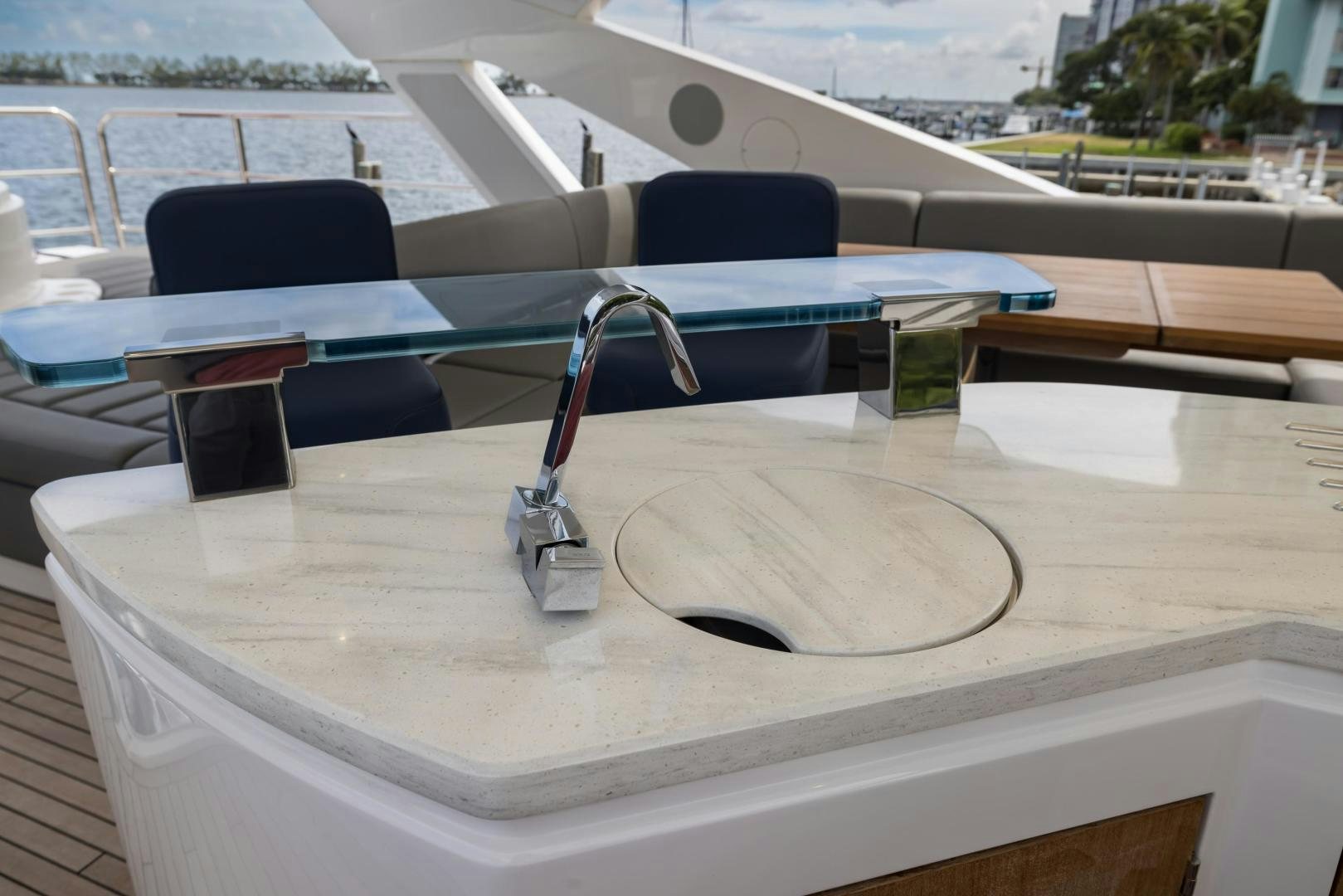 a white table with a black and silver object on it aboard MR. G Yacht for Sale