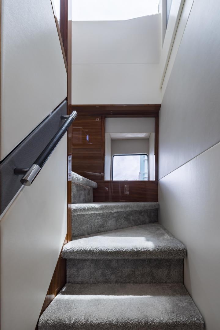 a staircase with a railing aboard MR. G Yacht for Sale
