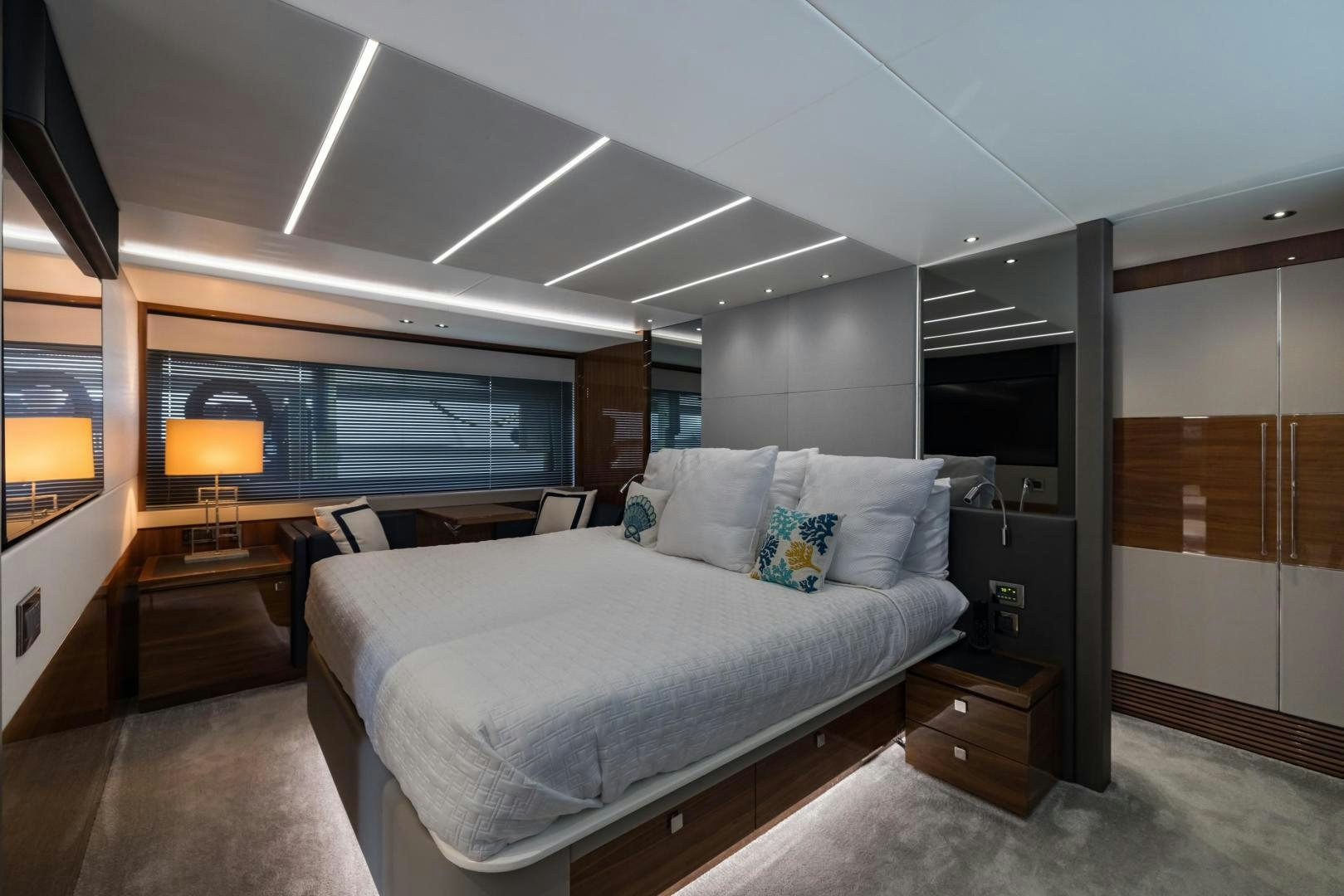 a bedroom with a large bed aboard MR. G Yacht for Sale