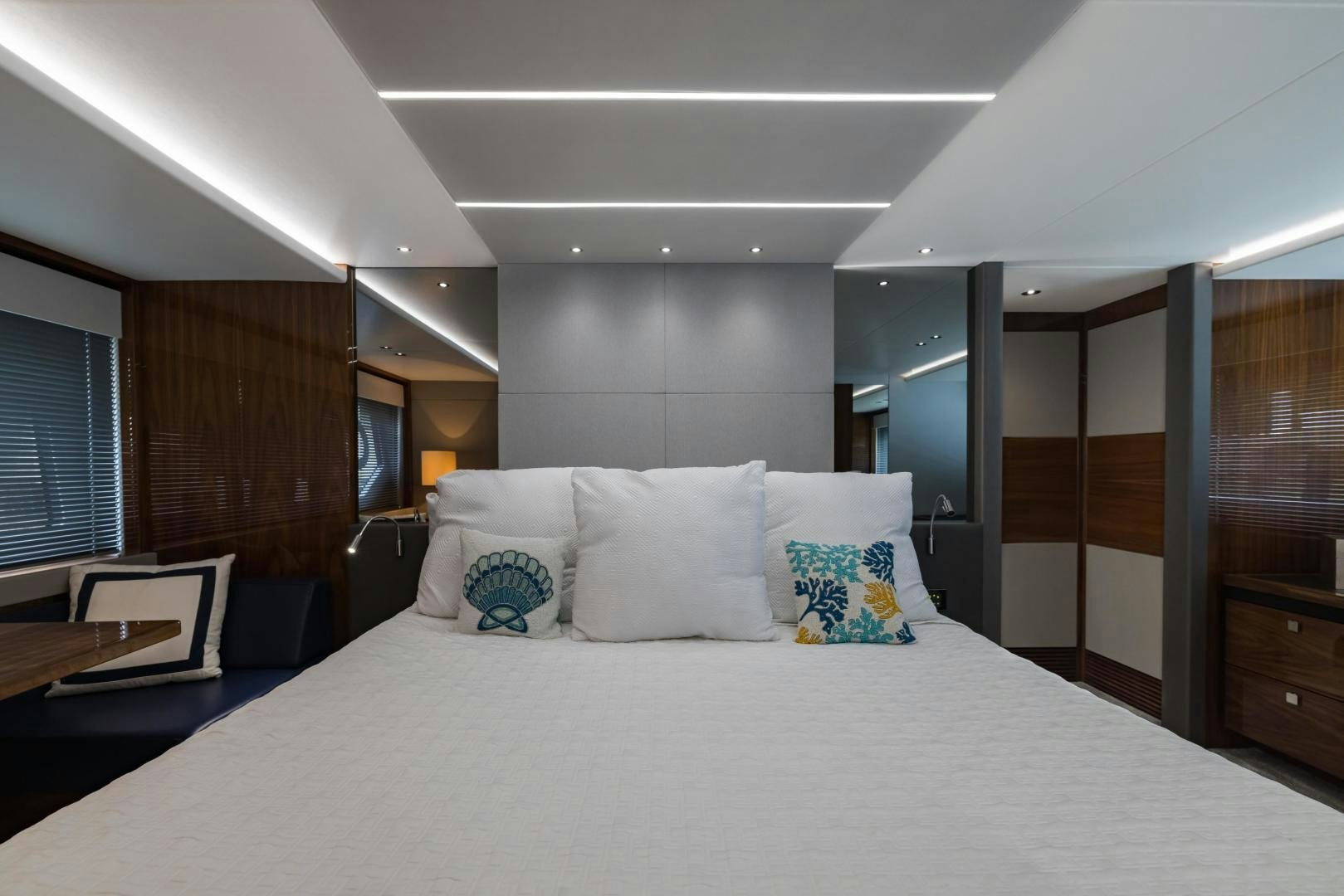 a large bed in a room aboard MR. G Yacht for Sale