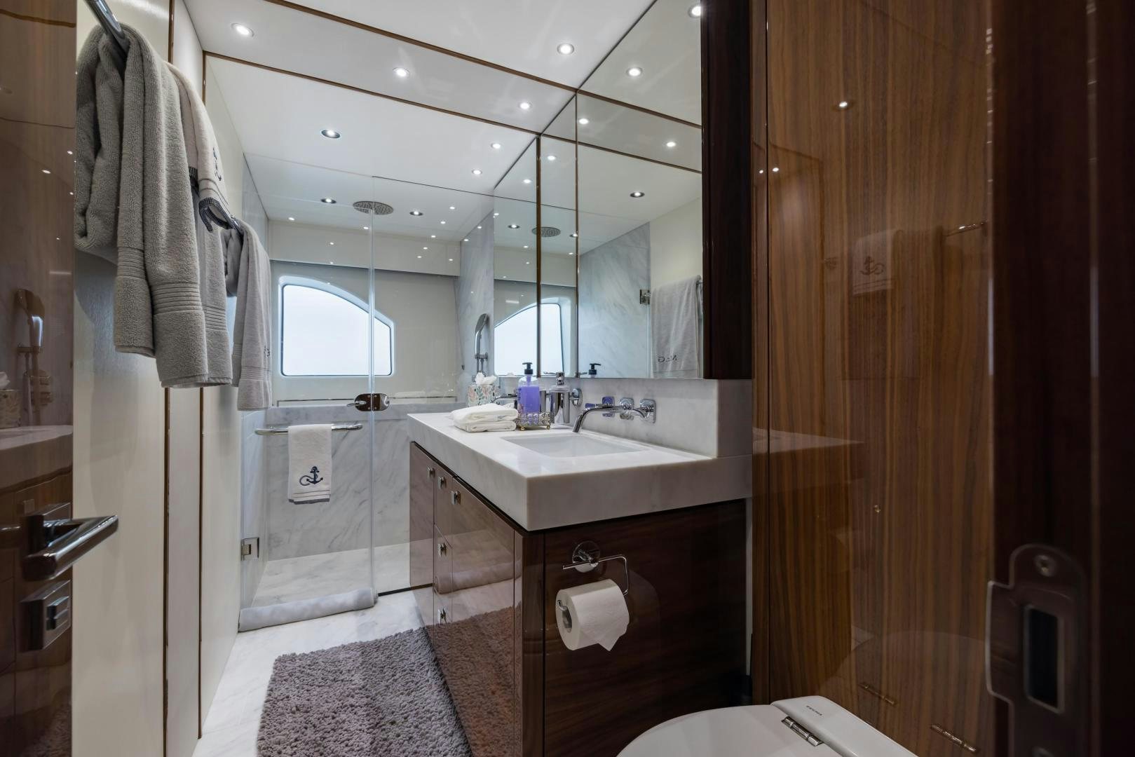 a bathroom with a sink and a mirror aboard MR. G Yacht for Sale
