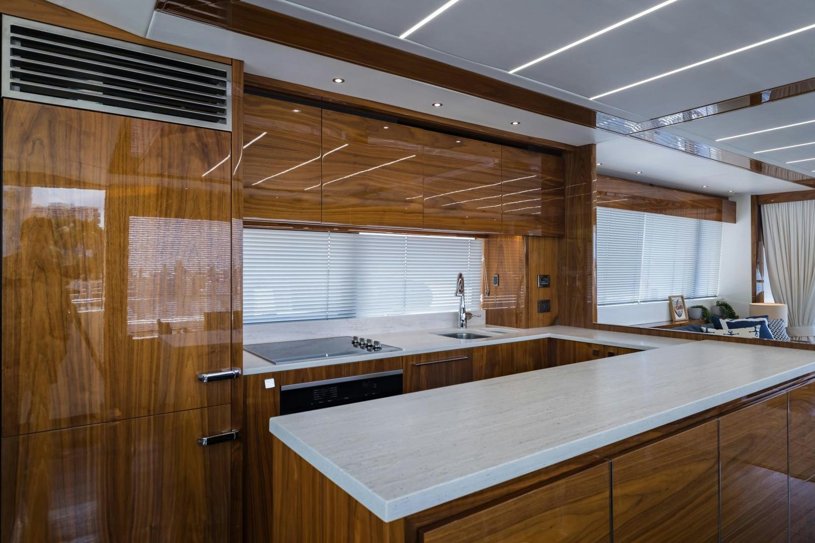 a kitchen with wooden cabinets aboard MR. G Yacht for Sale