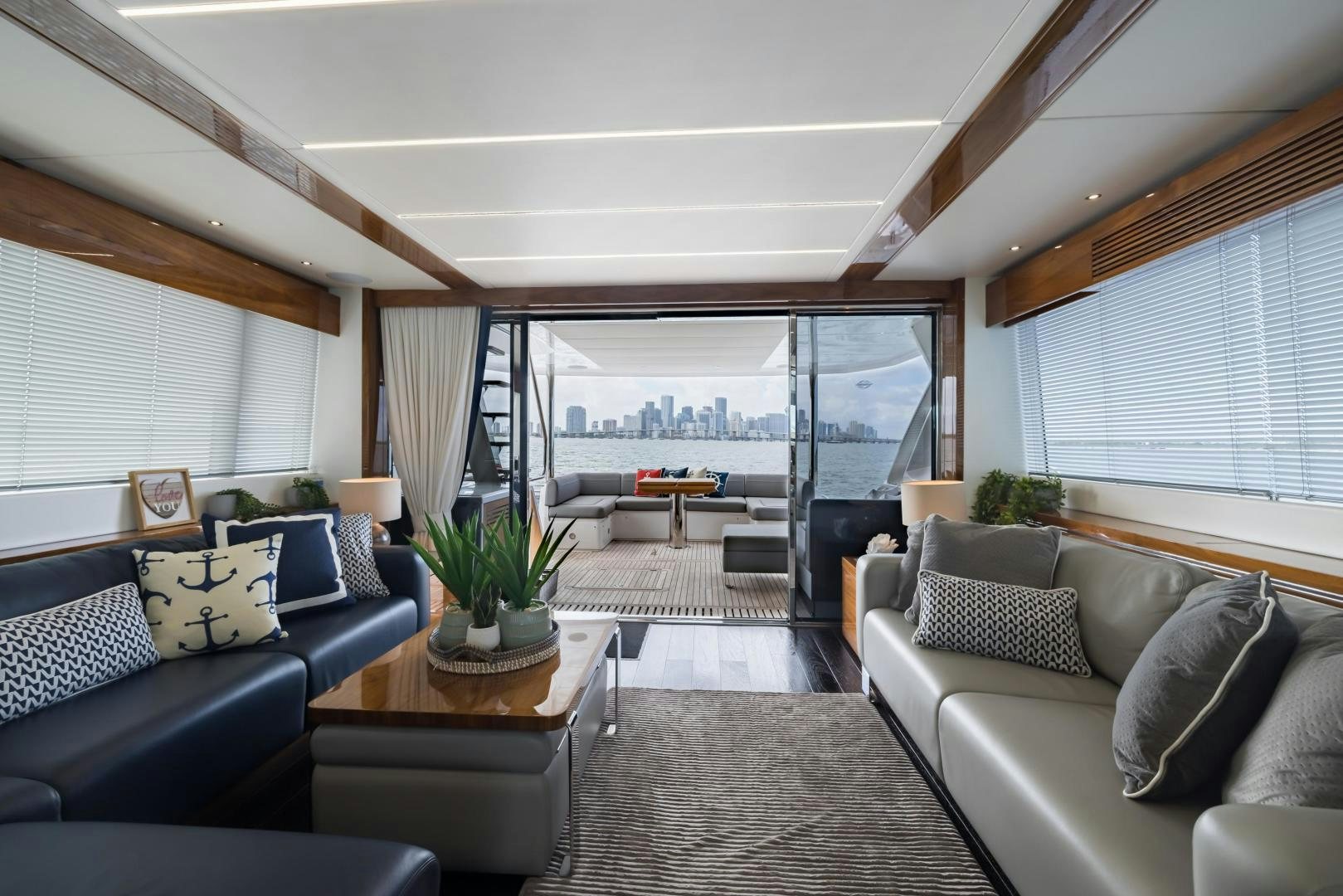 a living room with a large window aboard MR. G Yacht for Sale