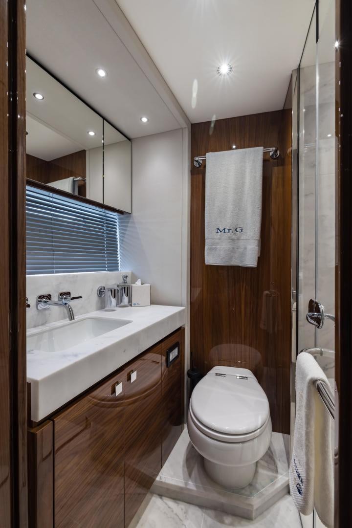 a bathroom with a toilet and sink aboard MR. G Yacht for Sale