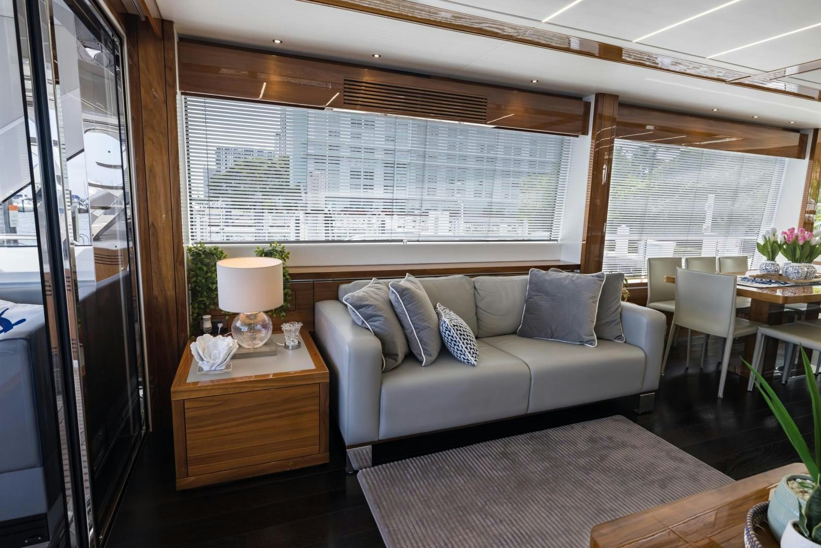 a living room with a couch and a table aboard MR. G Yacht for Sale