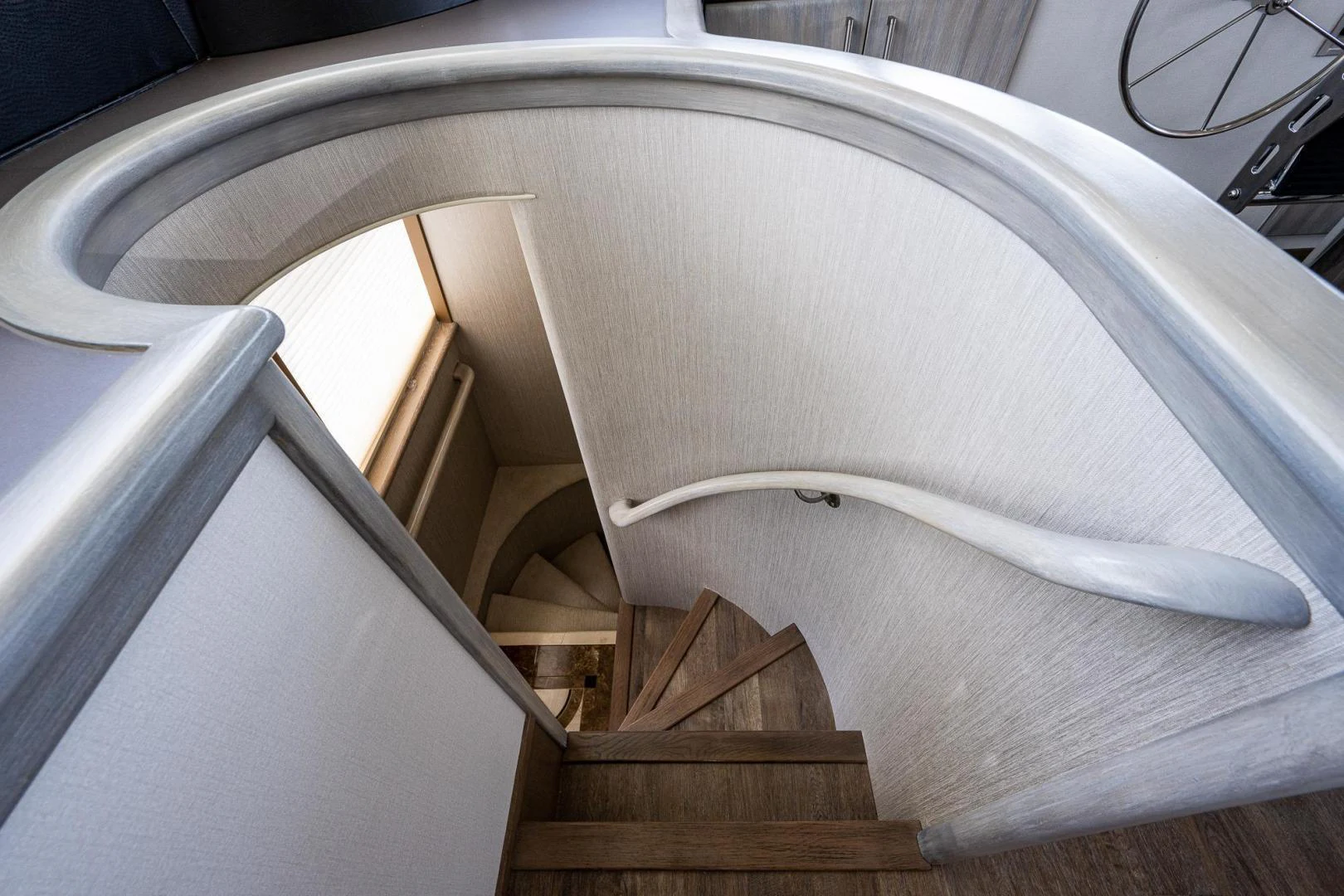 a white spiral staircase aboard ATLANTIC Yacht for Sale