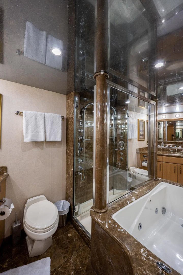 a bathroom with a glass shower aboard ATLANTIC Yacht for Sale