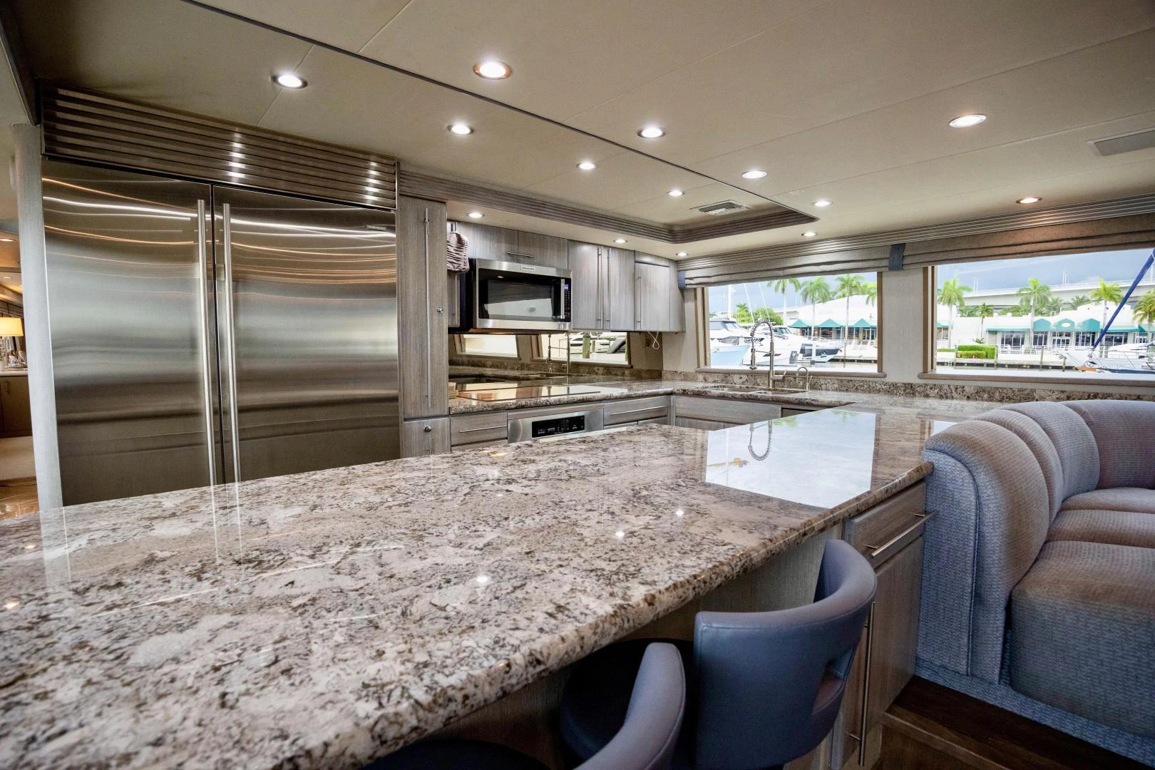 a large kitchen with a large marble table aboard ATLANTIC Yacht for Sale
