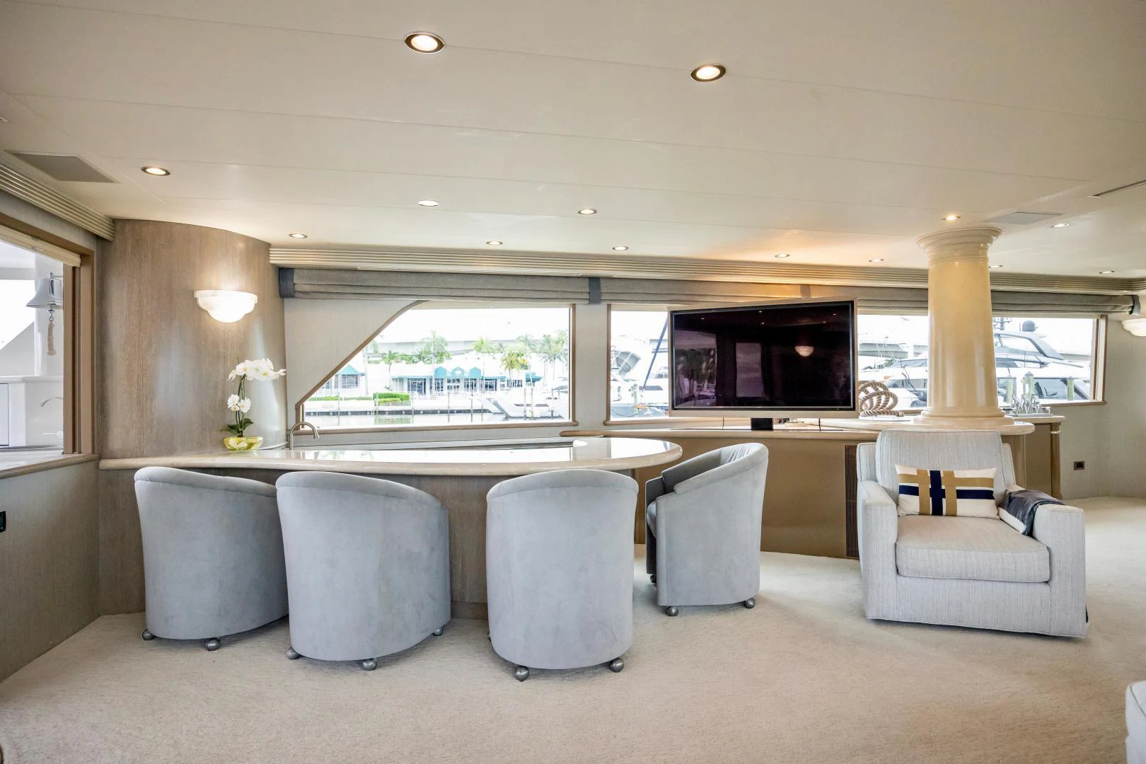 a large white and beige room with a large window and a large table aboard ATLANTIC Yacht for Sale
