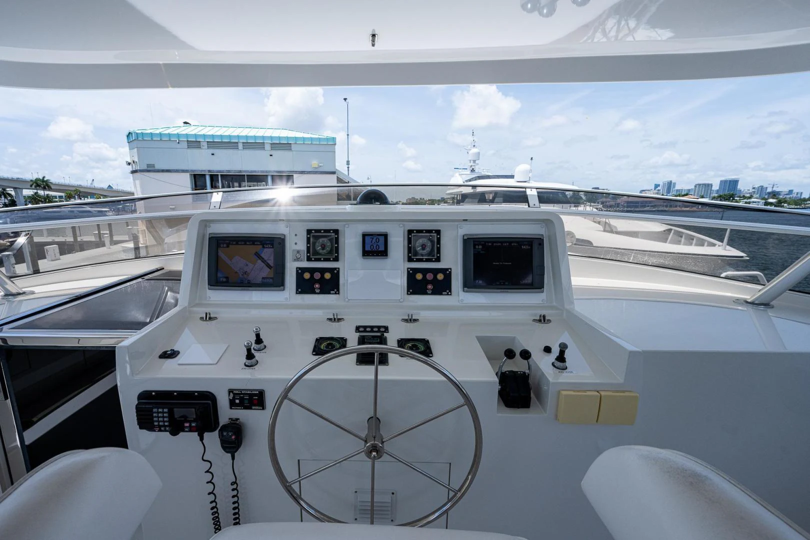 a white boat on a body of water aboard ATLANTIC Yacht for Sale