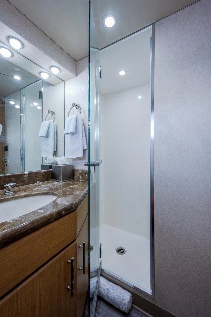 a bathroom with a glass shower aboard ATLANTIC Yacht for Sale