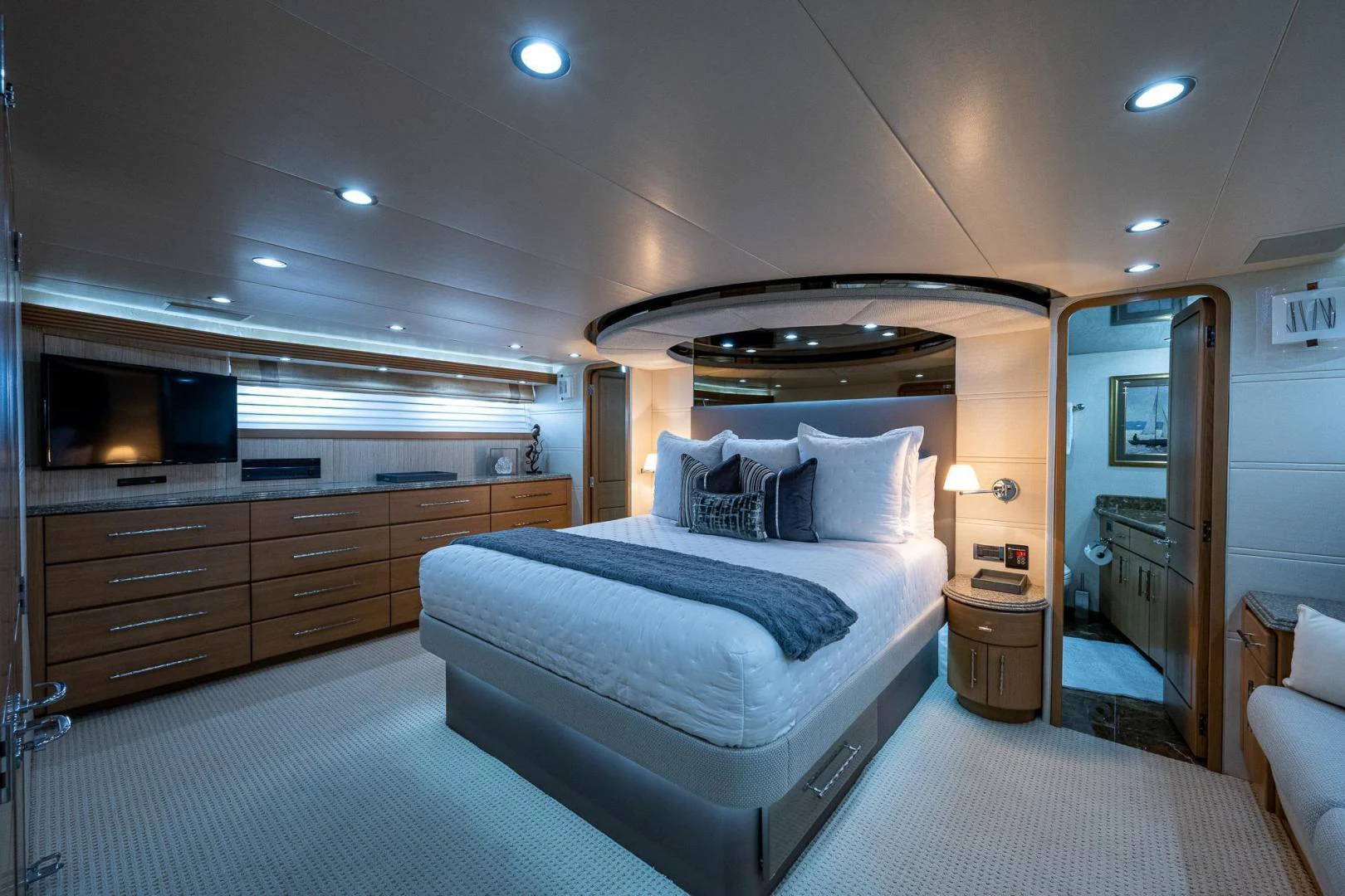 a bedroom with a bed and a dresser aboard ATLANTIC Yacht for Sale
