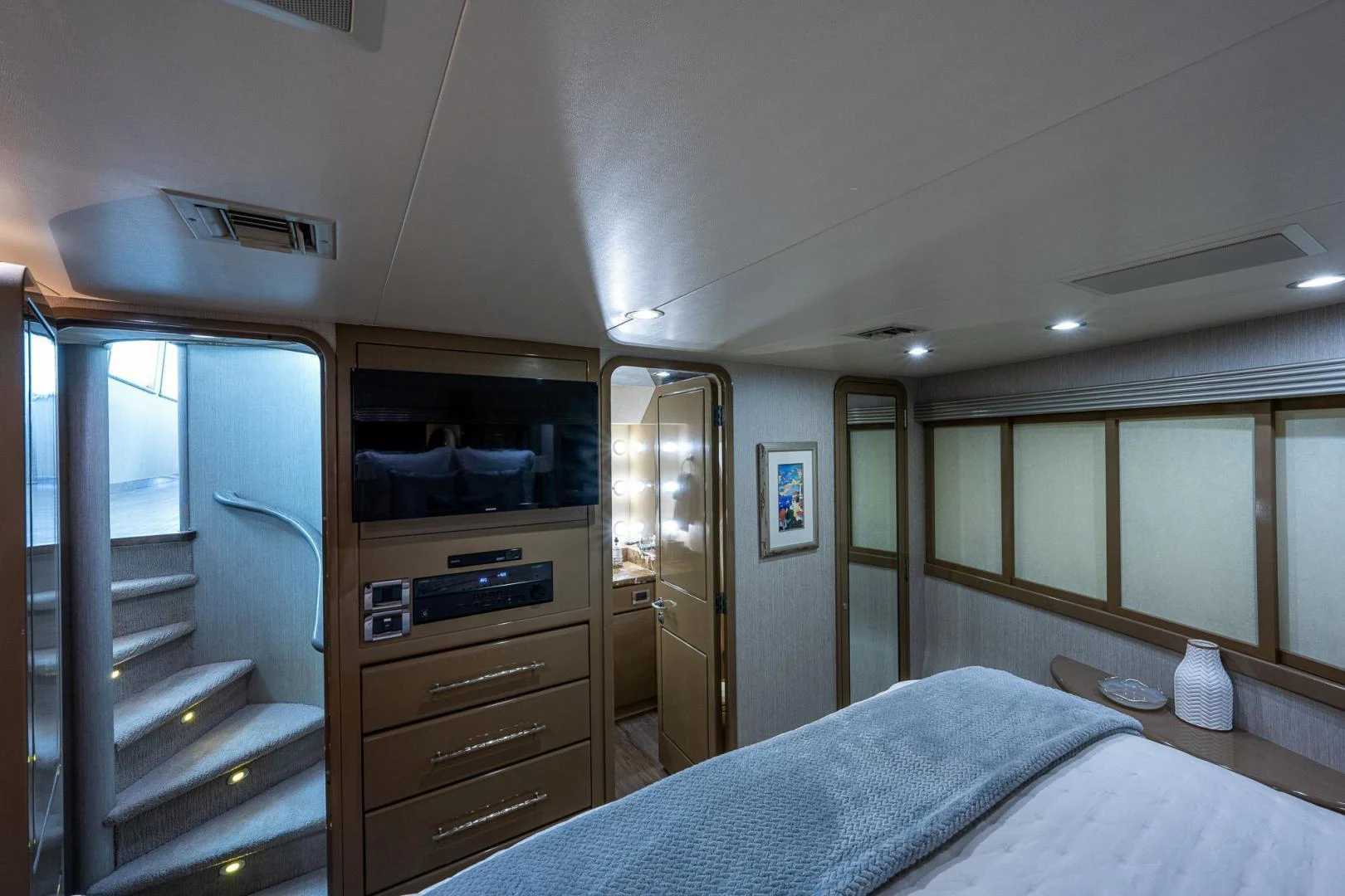 a bedroom with a closet and a bed aboard ATLANTIC Yacht for Sale