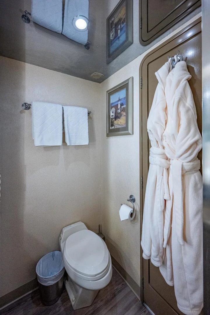 a bathroom with towels on the wall aboard ATLANTIC Yacht for Sale