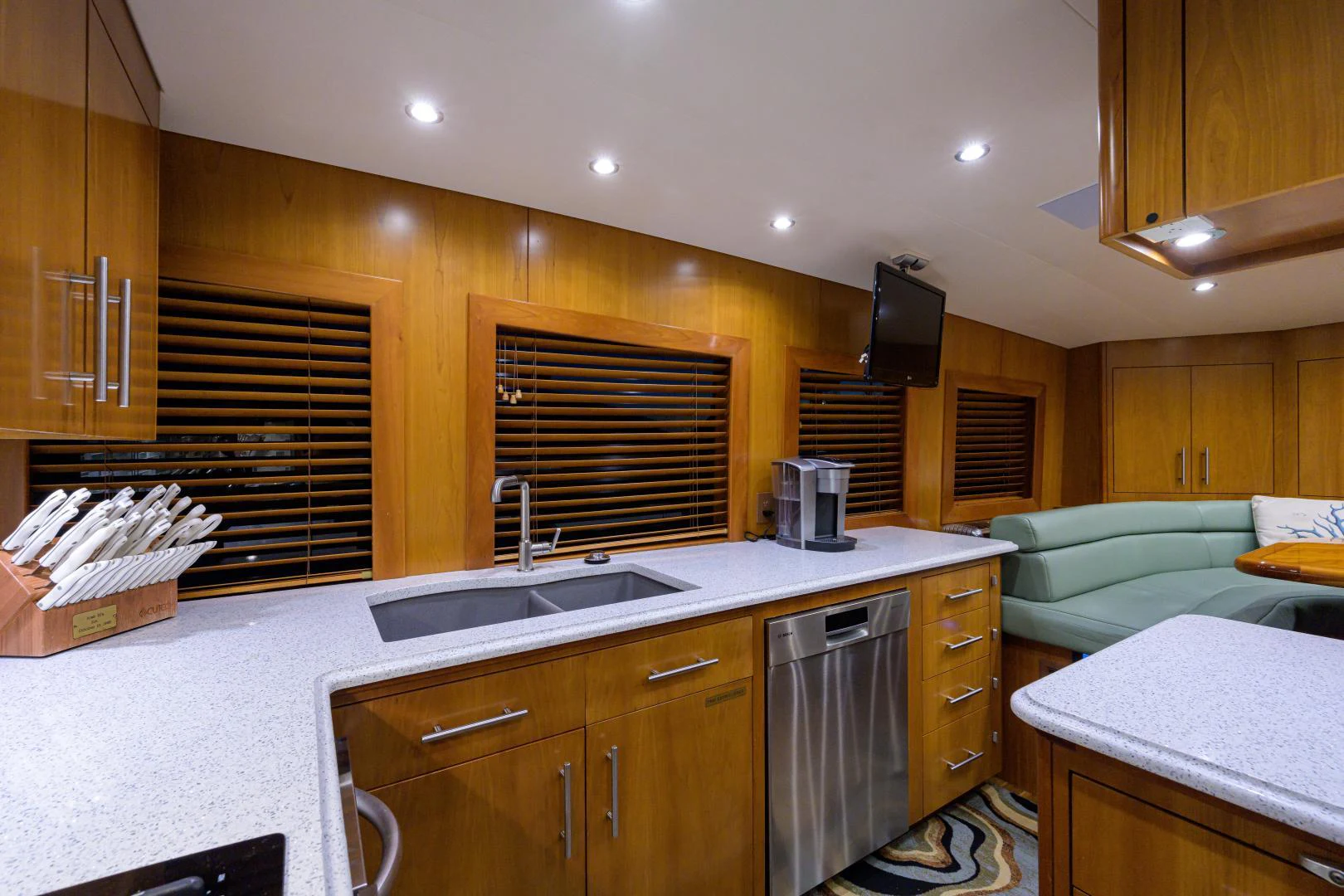 a kitchen with wooden cabinets aboard IRISH EI'S Yacht for Sale