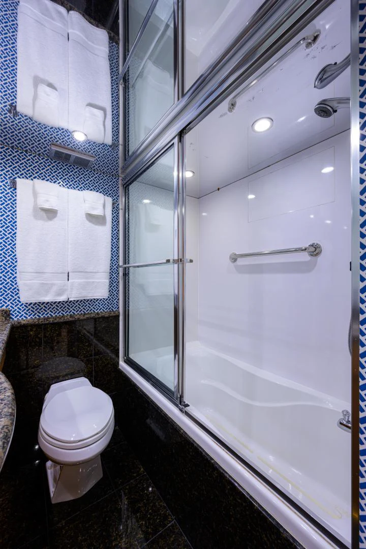 a bathroom with a glass shower aboard IRISH EI'S Yacht for Sale