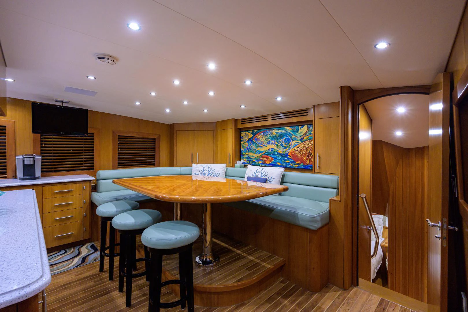 a room with a table and chairs aboard IRISH EI'S Yacht for Sale