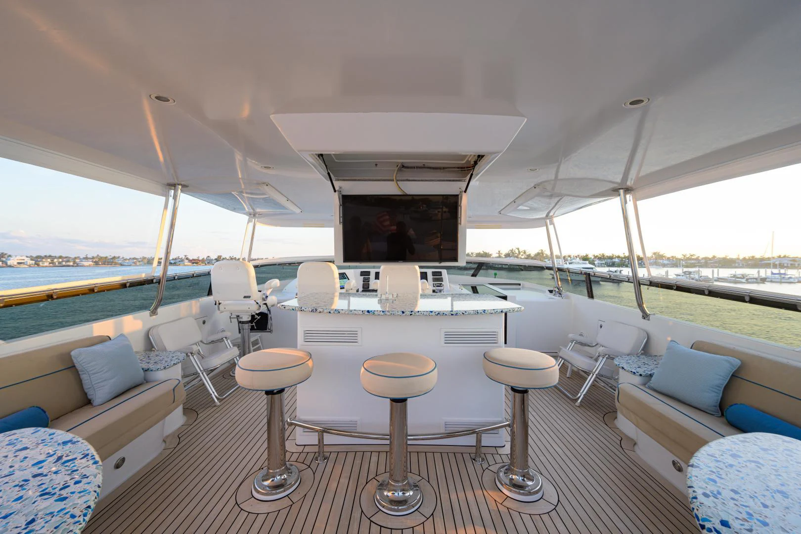 a boat with stools and tables aboard IRISH EI'S Yacht for Sale