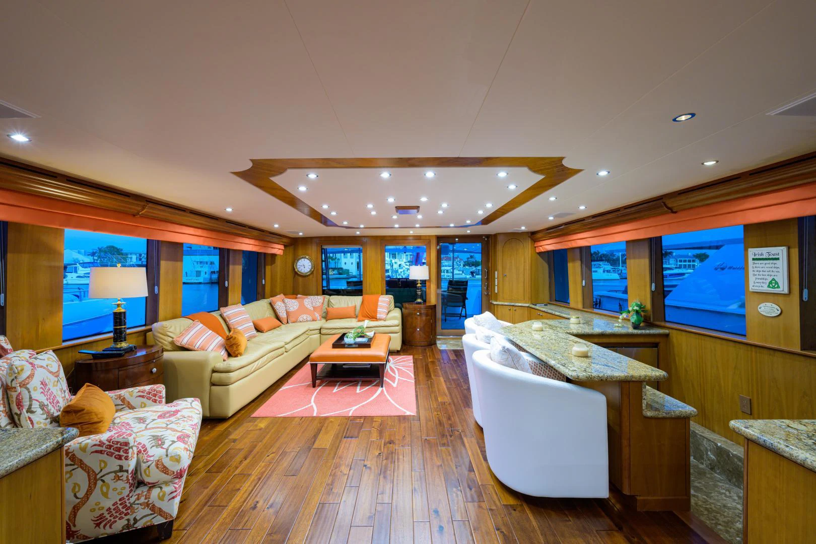 a living room with a large window aboard IRISH EI'S Yacht for Sale