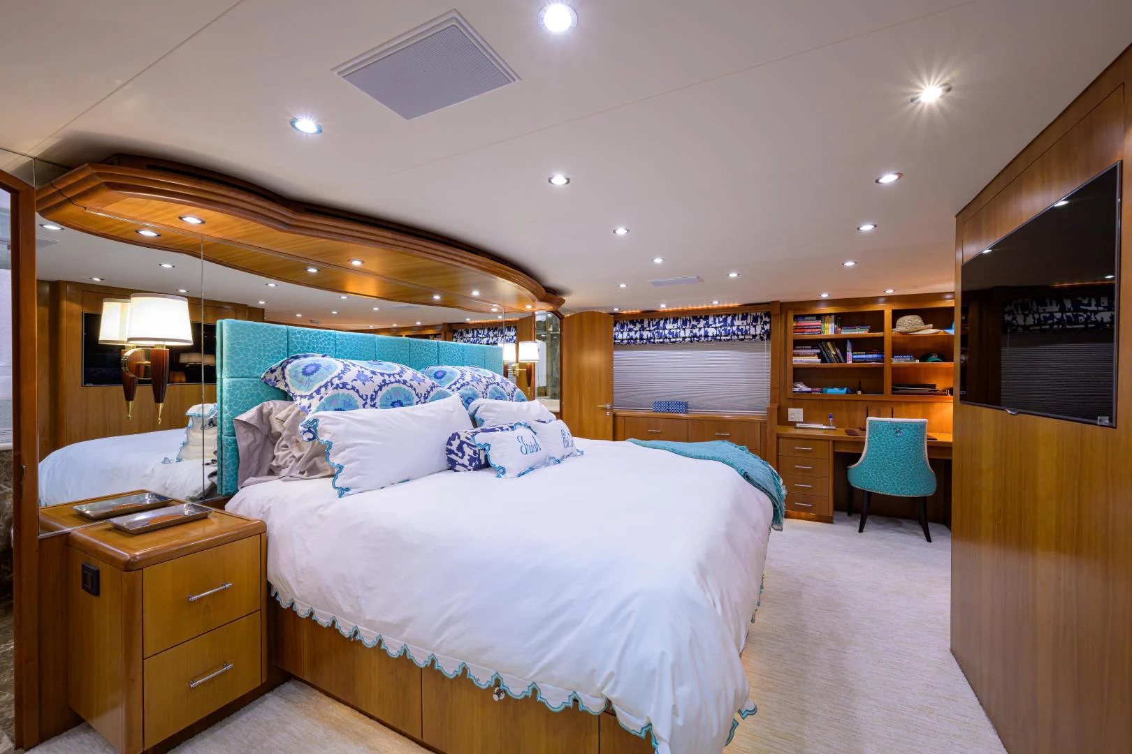 a bedroom with a bed and a desk aboard IRISH EI'S Yacht for Sale