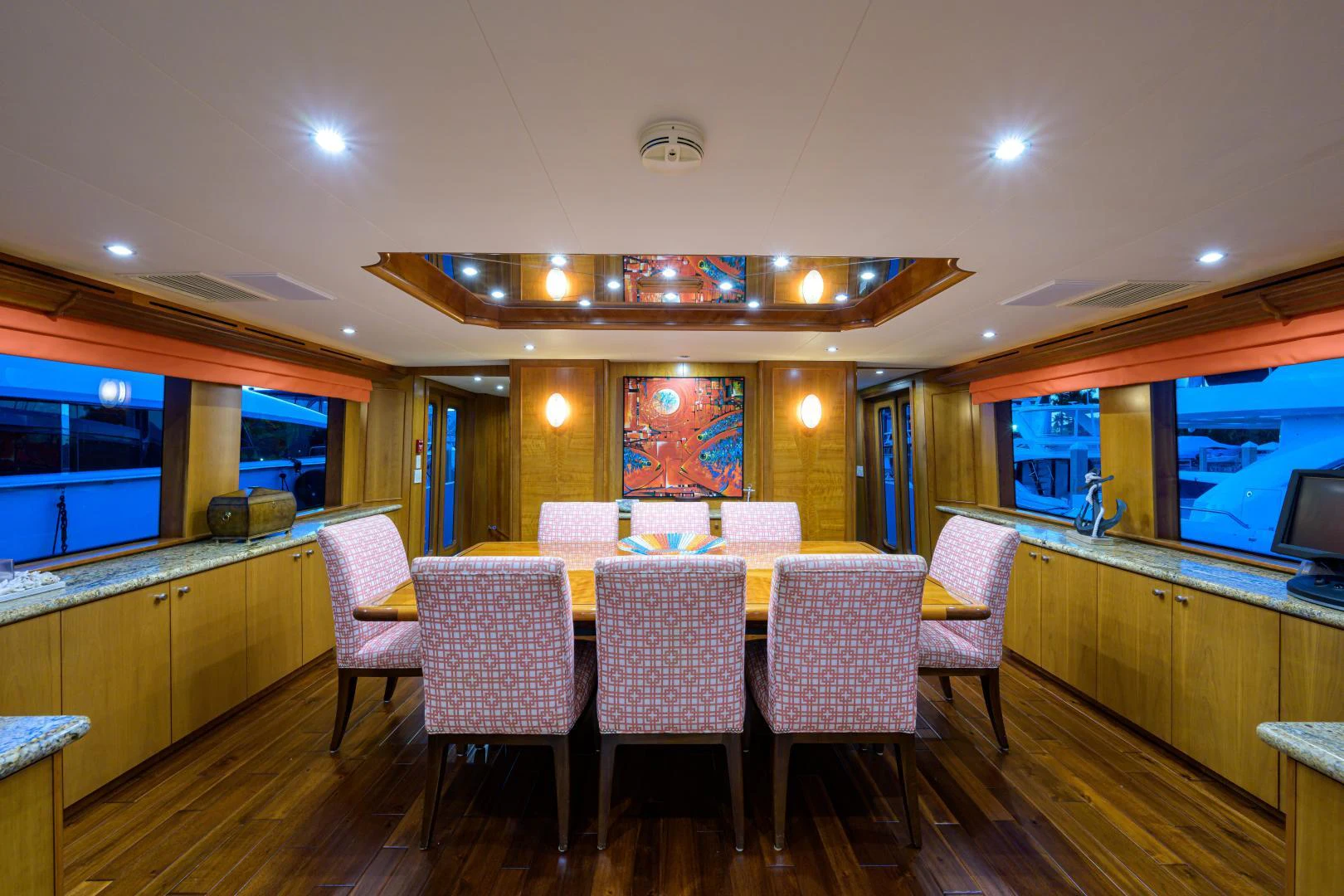 a large room with a table and chairs aboard IRISH EI'S Yacht for Sale