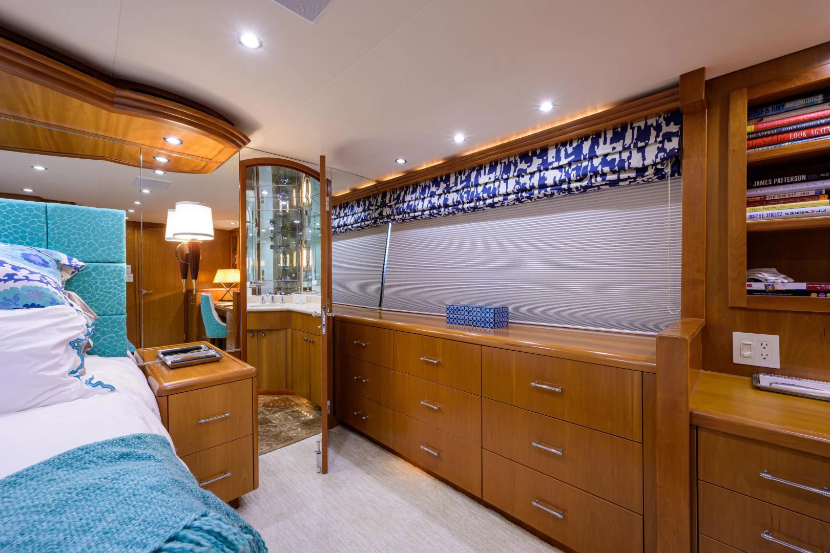 a bedroom with a dresser and a mirror aboard IRISH EI'S Yacht for Sale