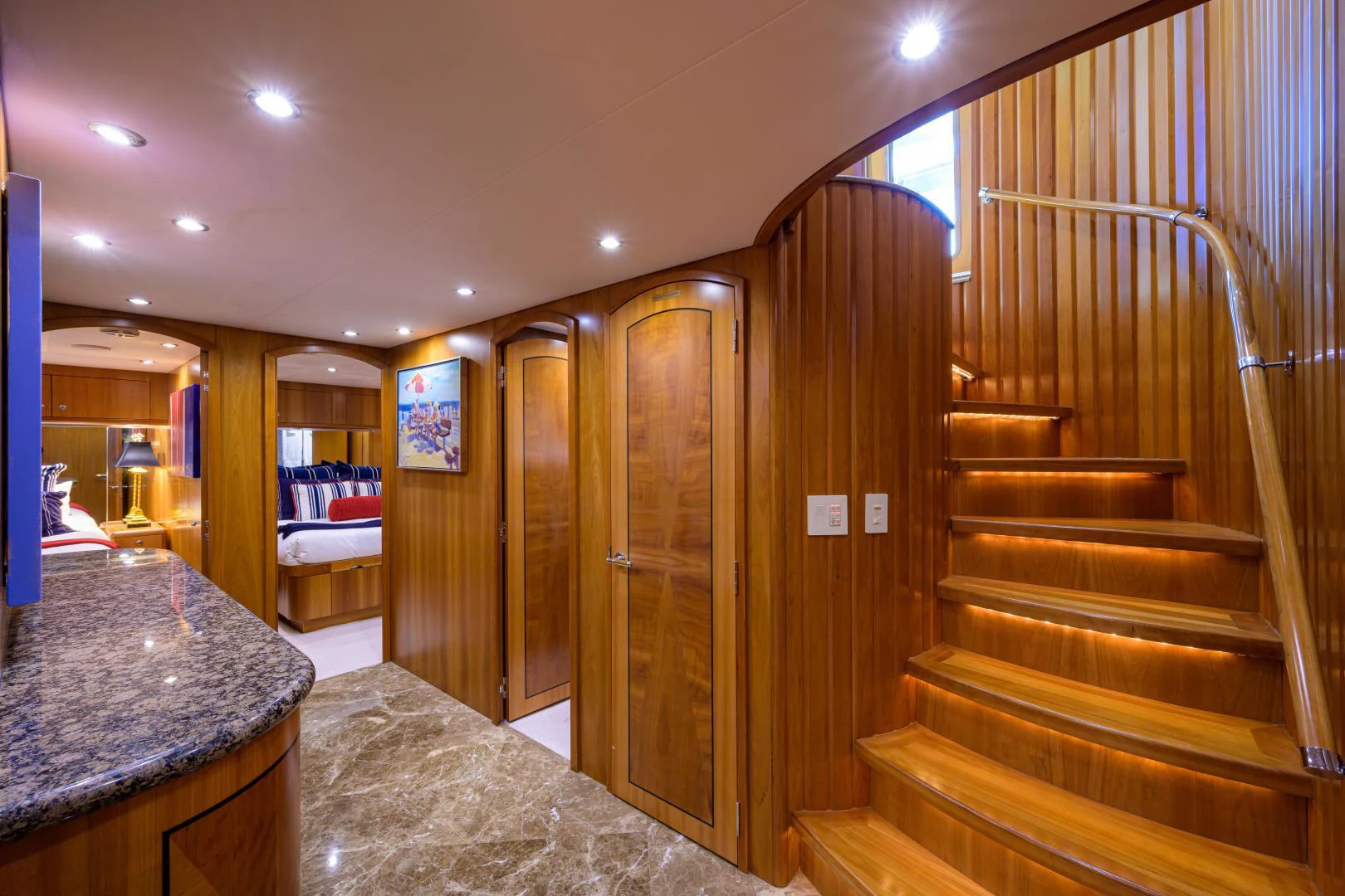 a large bathroom with a large wood closet and a large wood door aboard IRISH EI'S Yacht for Sale