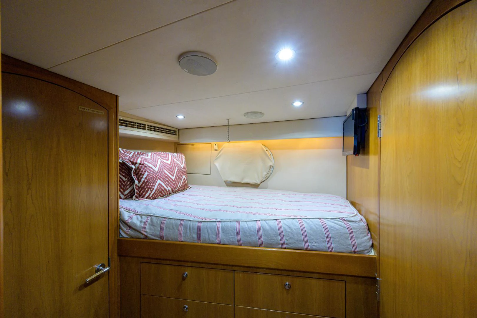a bed with a wooden headboard aboard IRISH EI'S Yacht for Sale