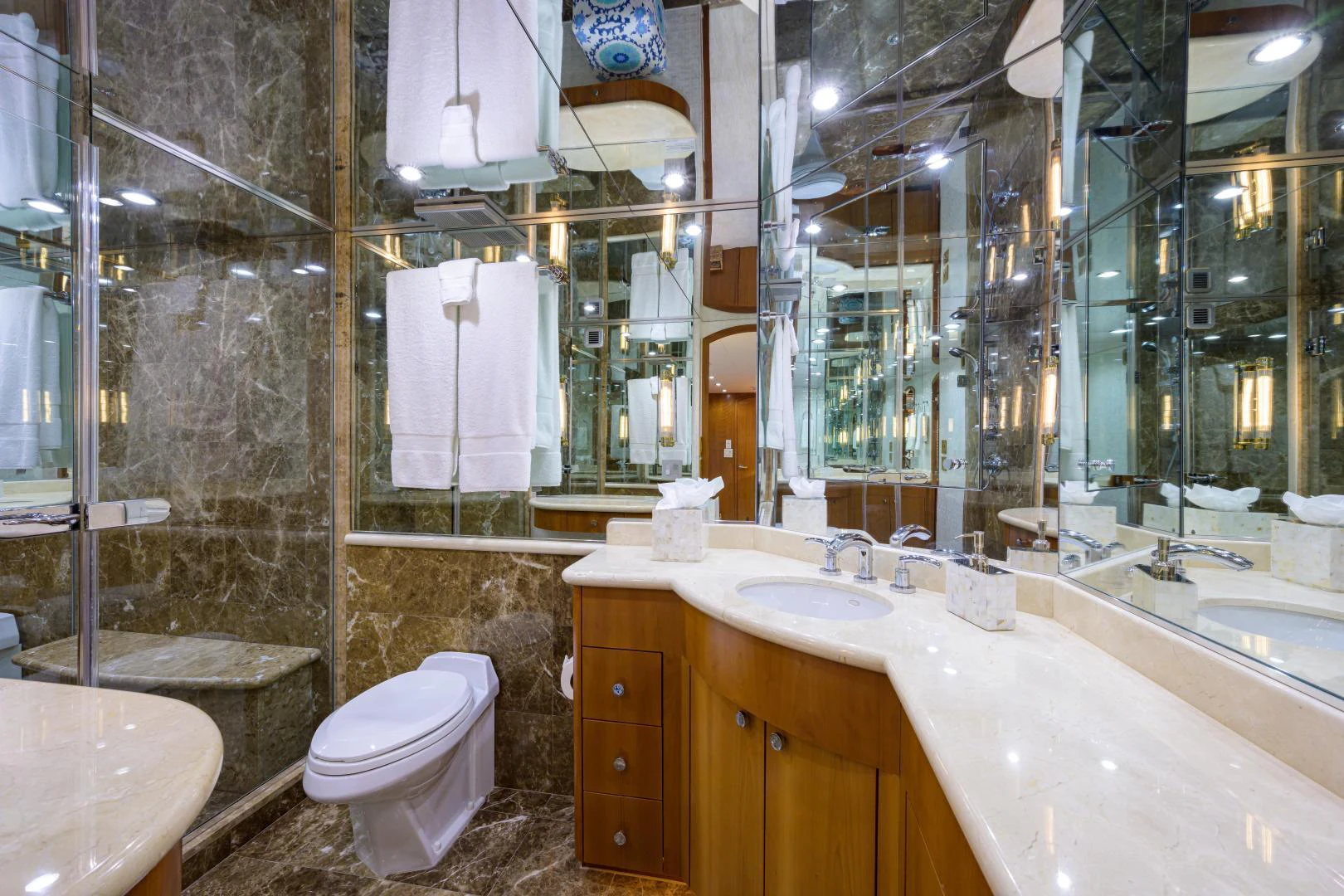 a bathroom with a large mirror aboard IRISH EI'S Yacht for Sale