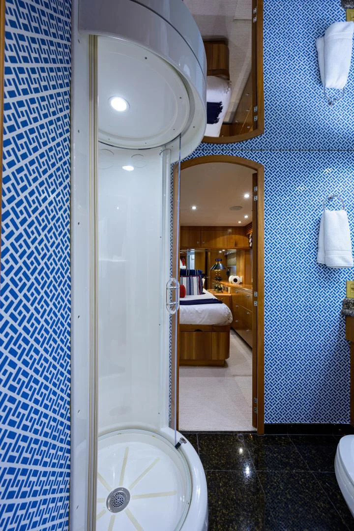 a bathroom with a glass shower aboard IRISH EI'S Yacht for Sale
