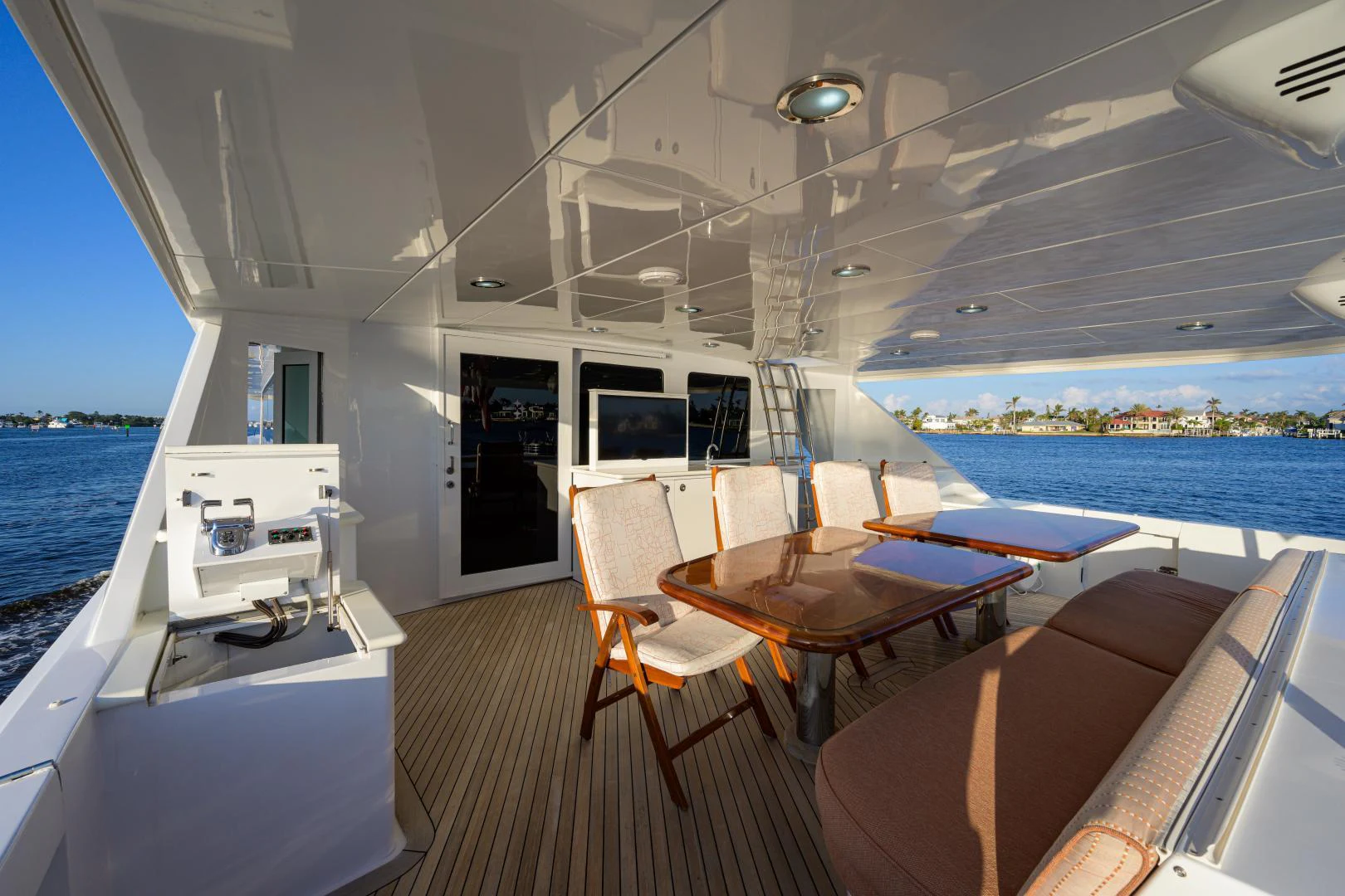 a boat with a table and chairs aboard IRISH EI'S Yacht for Sale