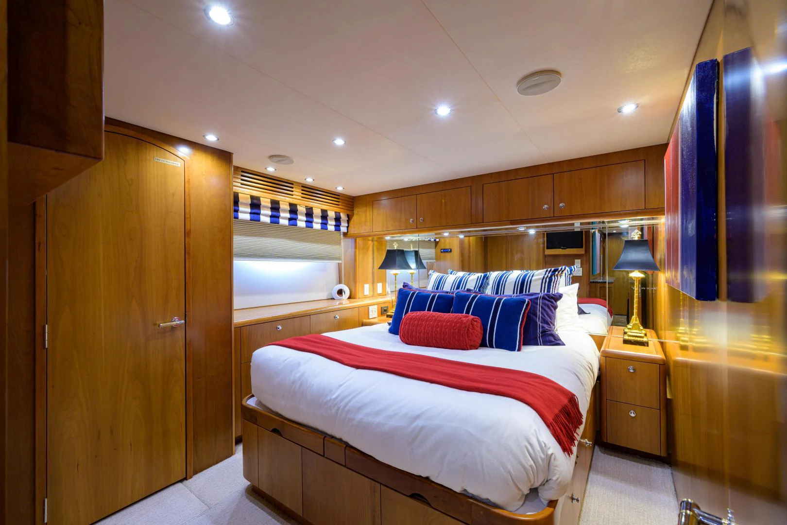 a bedroom with a bed and a desk aboard IRISH EI'S Yacht for Sale