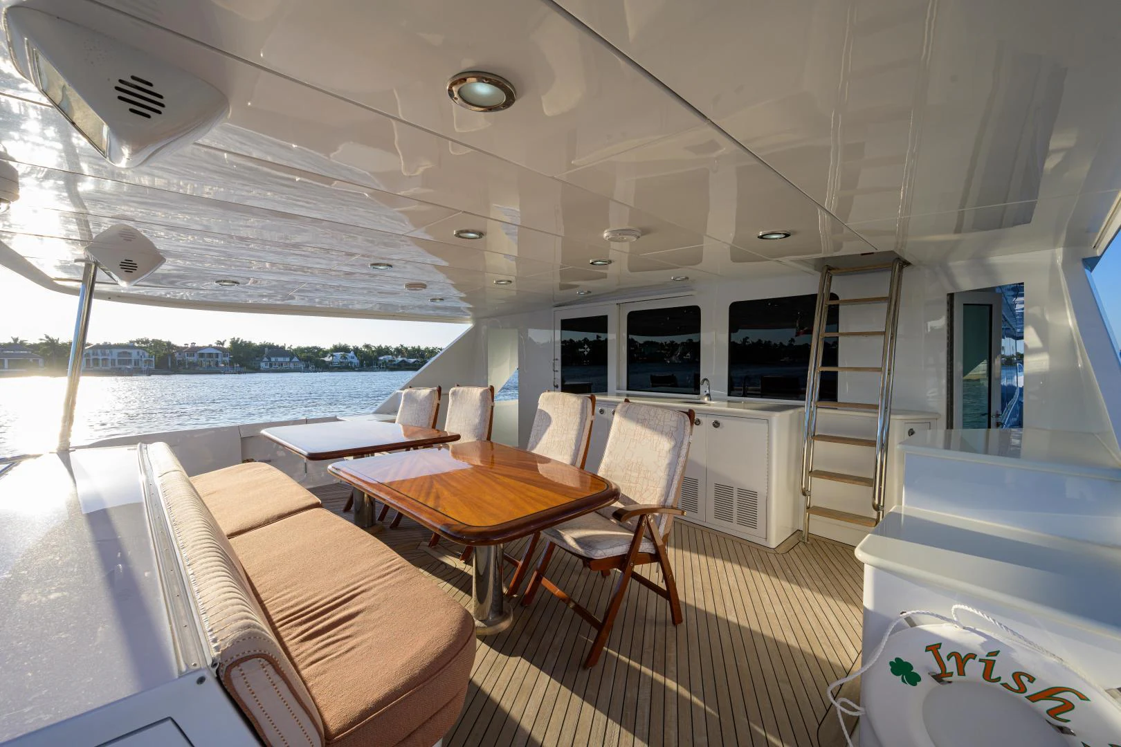 a boat with a table and chairs aboard IRISH EI'S Yacht for Sale