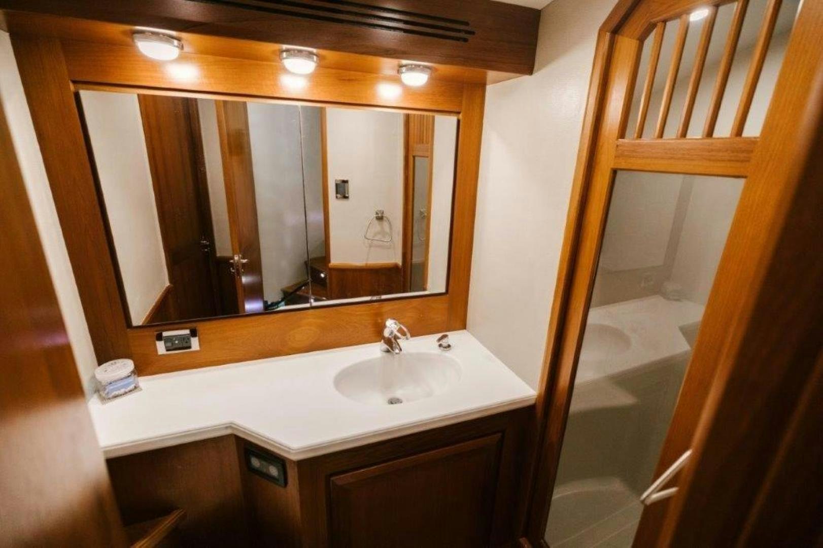 a bathroom with a mirror aboard PULLIN WIRE Yacht for Sale