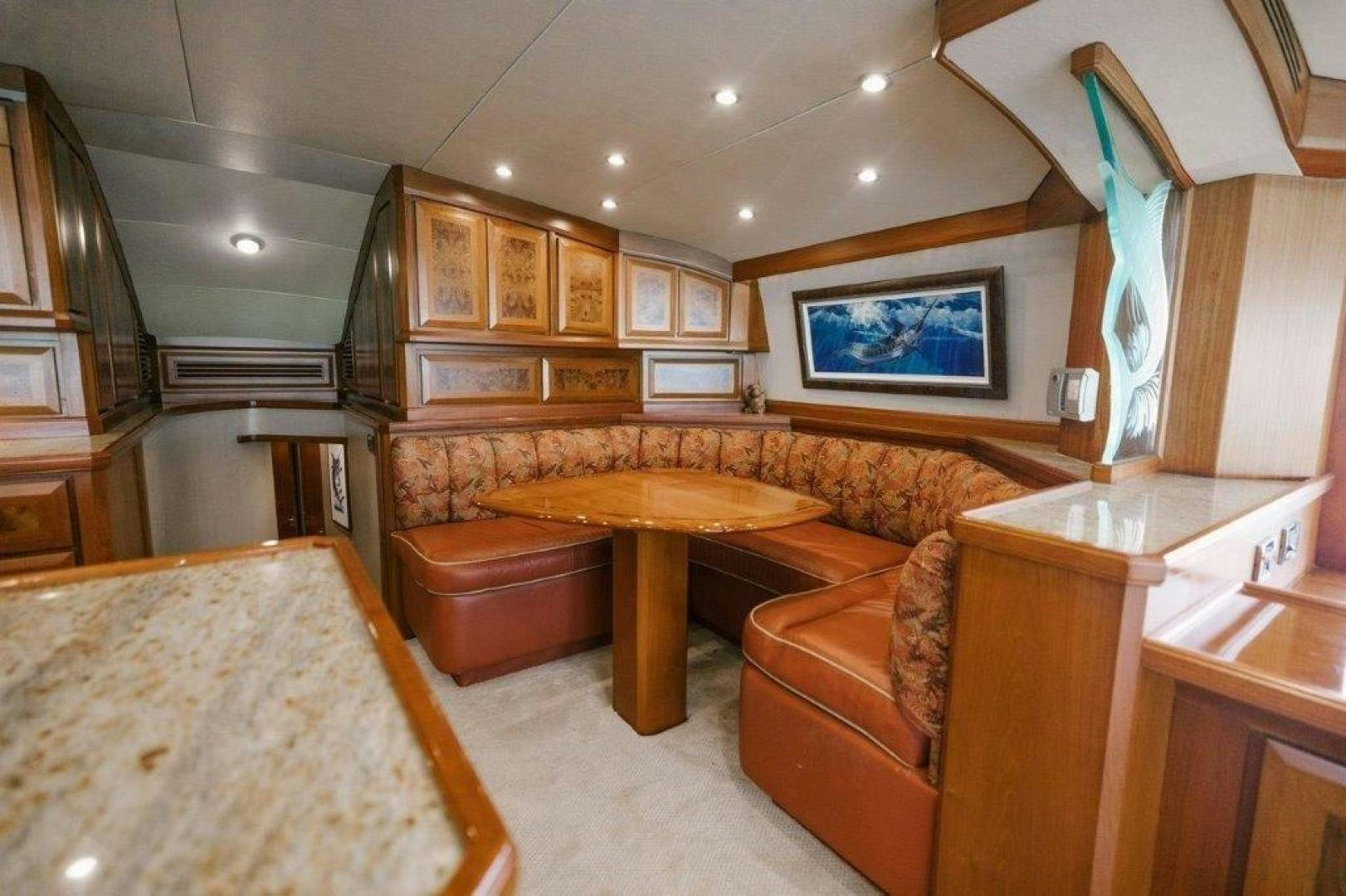 a large room with a table and chairs aboard PULLIN WIRE Yacht for Sale
