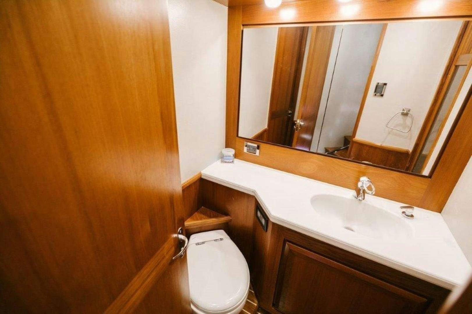 a bathroom with a toilet and a sink aboard PULLIN WIRE Yacht for Sale