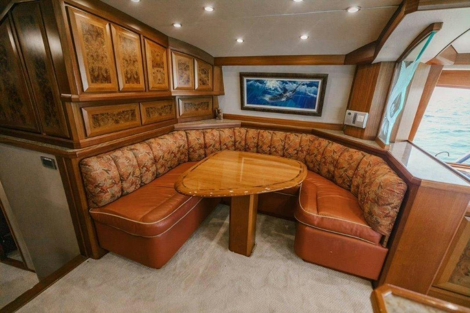 a living room with a couch and a table aboard PULLIN WIRE Yacht for Sale