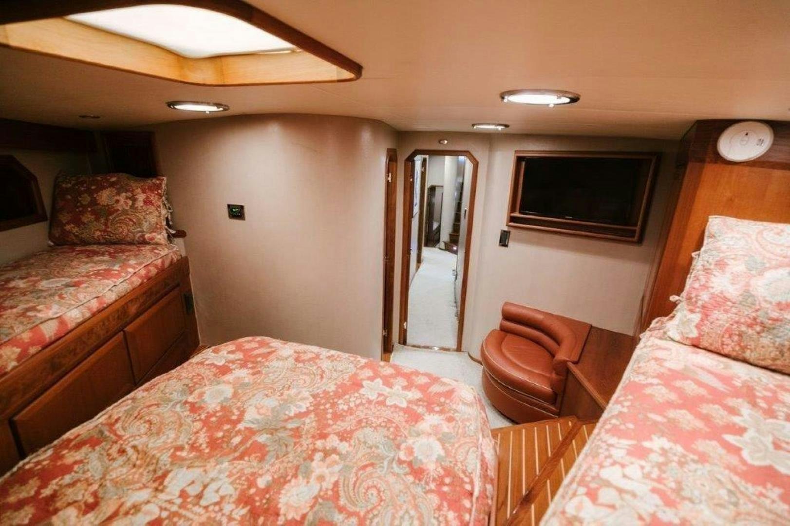 a bedroom with two beds aboard PULLIN WIRE Yacht for Sale