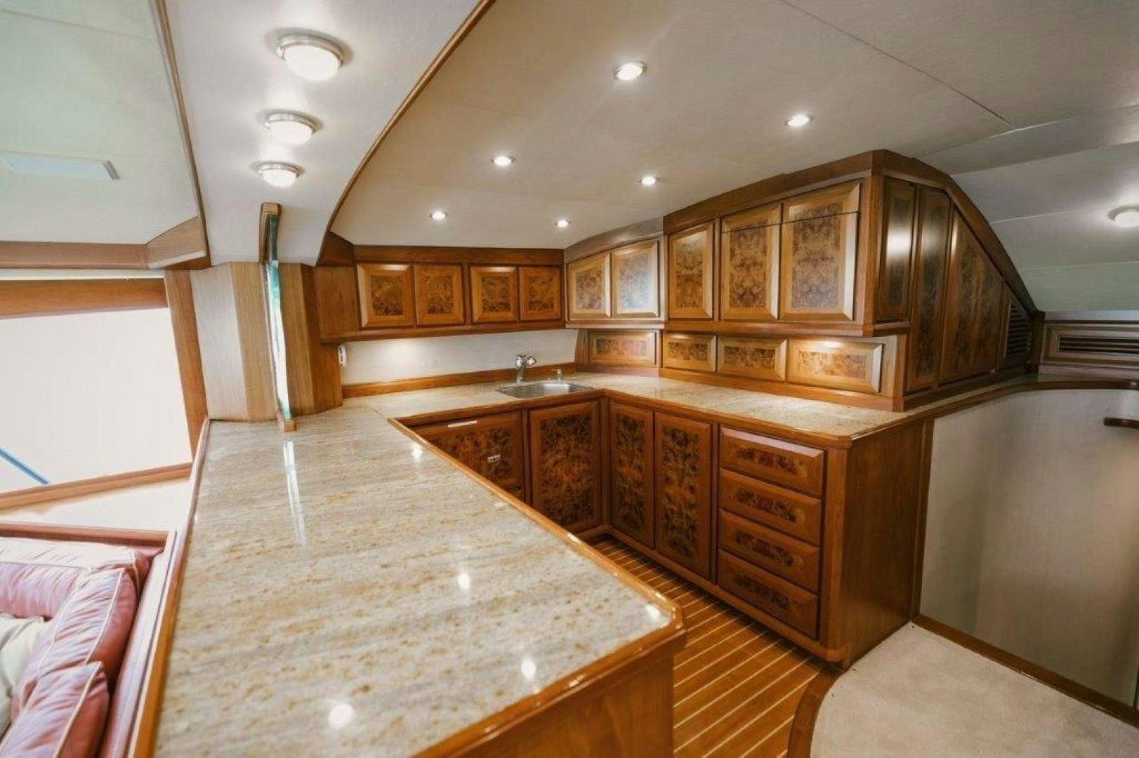a large kitchen with wooden cabinets aboard PULLIN WIRE Yacht for Sale