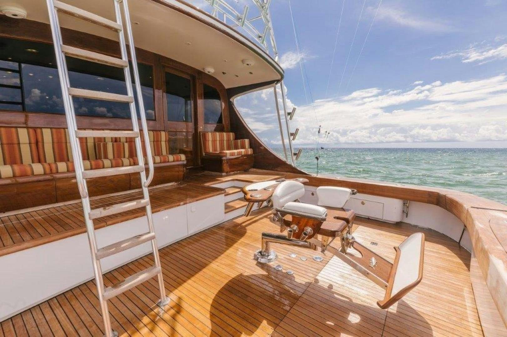 a deck with a view of the ocean and the ocean aboard PULLIN WIRE Yacht for Sale
