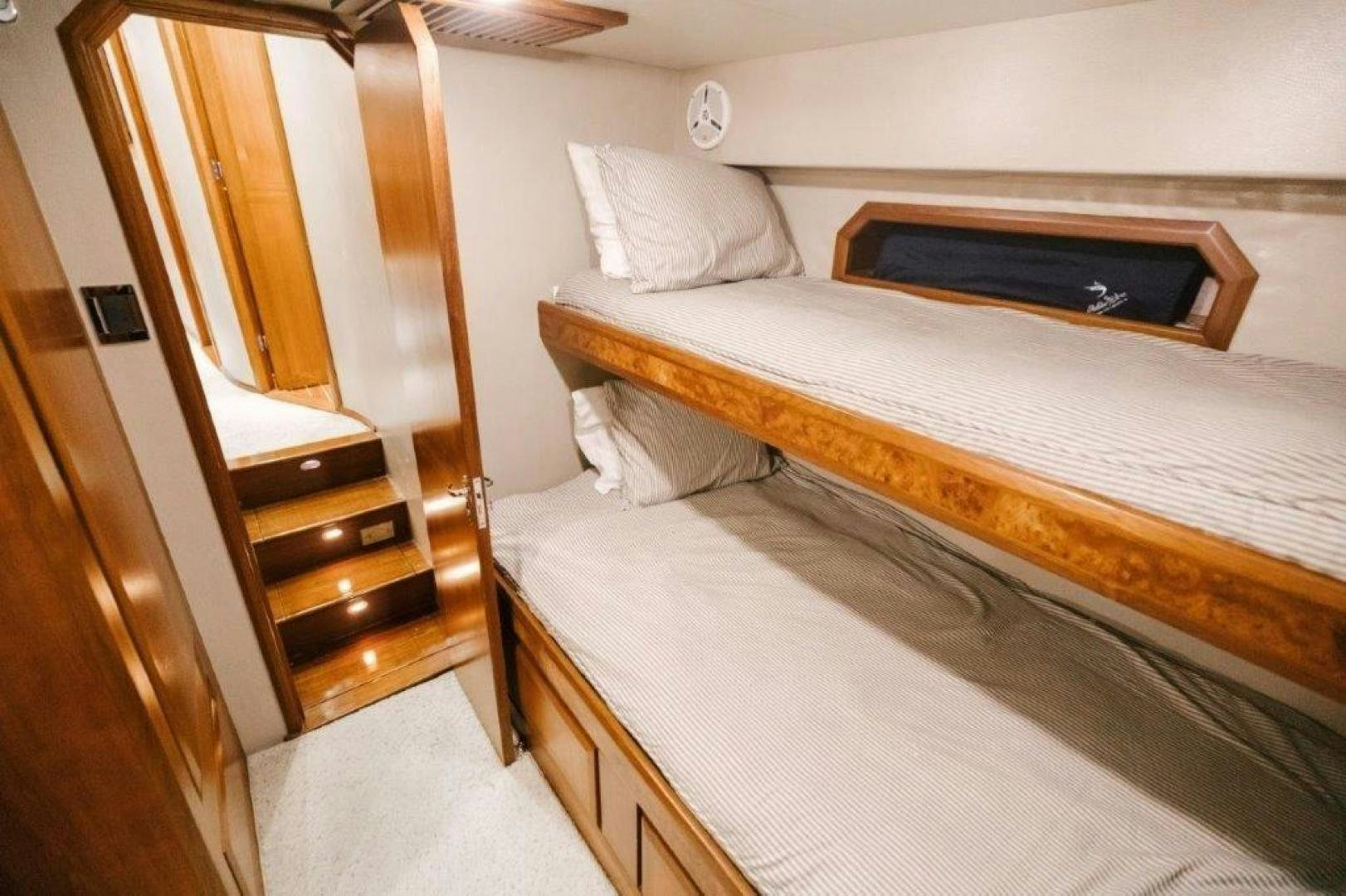 a bed with a white sheet aboard PULLIN WIRE Yacht for Sale