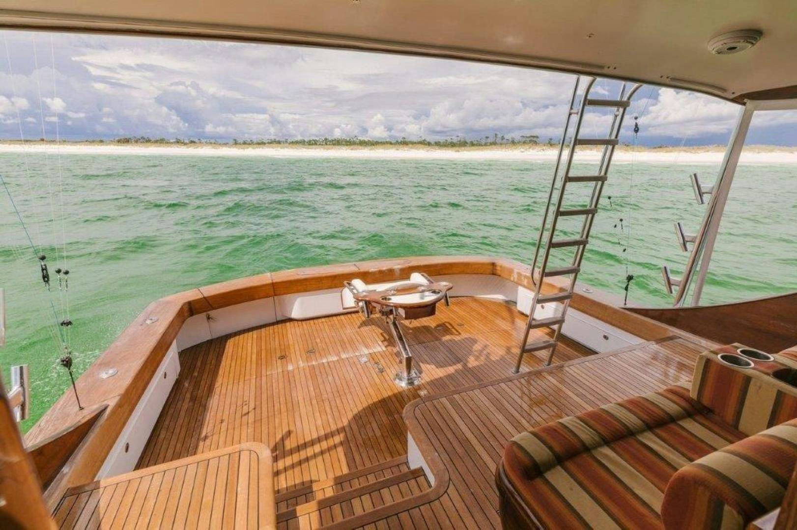 a deck with a view of the ocean and the city below aboard PULLIN WIRE Yacht for Sale