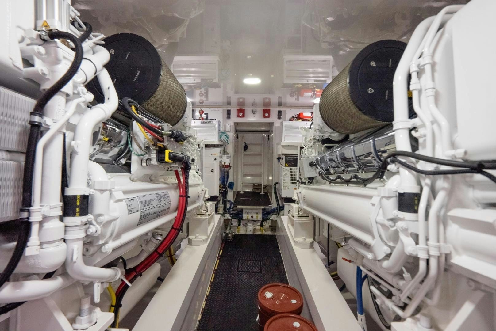 a large white machine in a room aboard DAWG DAZE Yacht for Sale