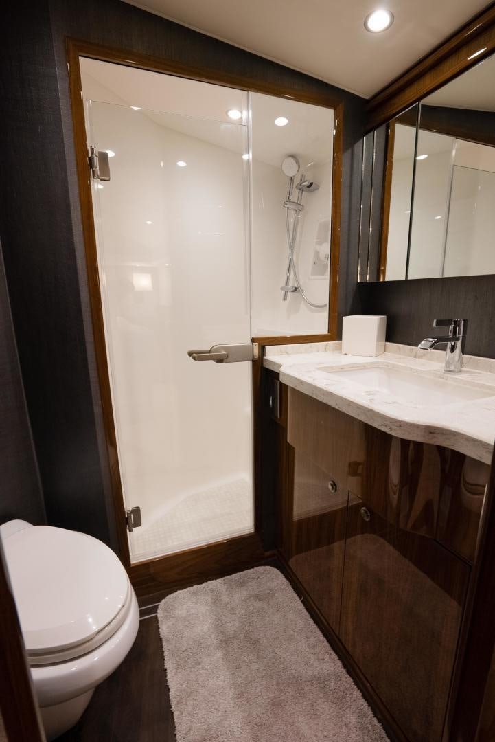 a bathroom with a sink and a toilet aboard DAWG DAZE Yacht for Sale
