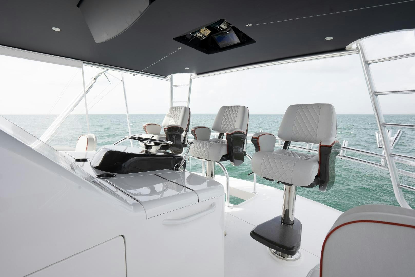 a room with a table and chairs aboard DAWG DAZE Yacht for Sale