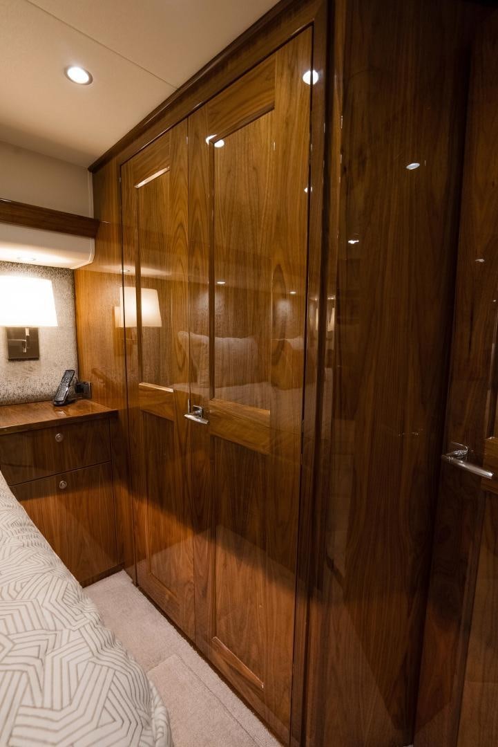 a wood cabinet in a room aboard DAWG DAZE Yacht for Sale