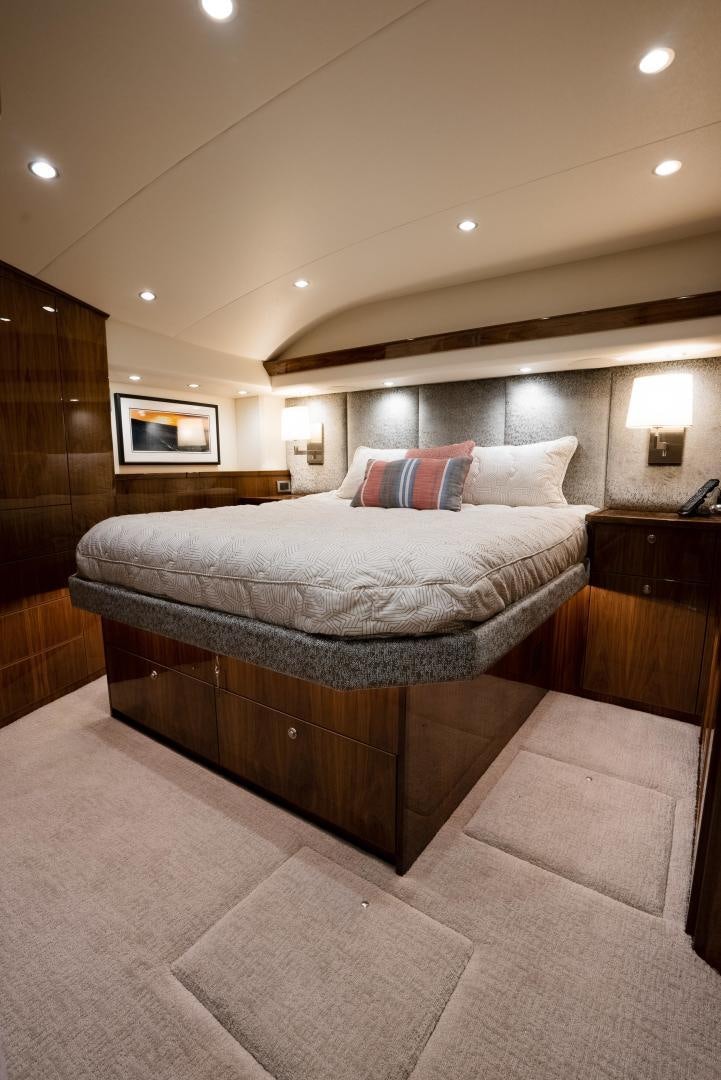 a large bed in a hotel room aboard DAWG DAZE Yacht for Sale